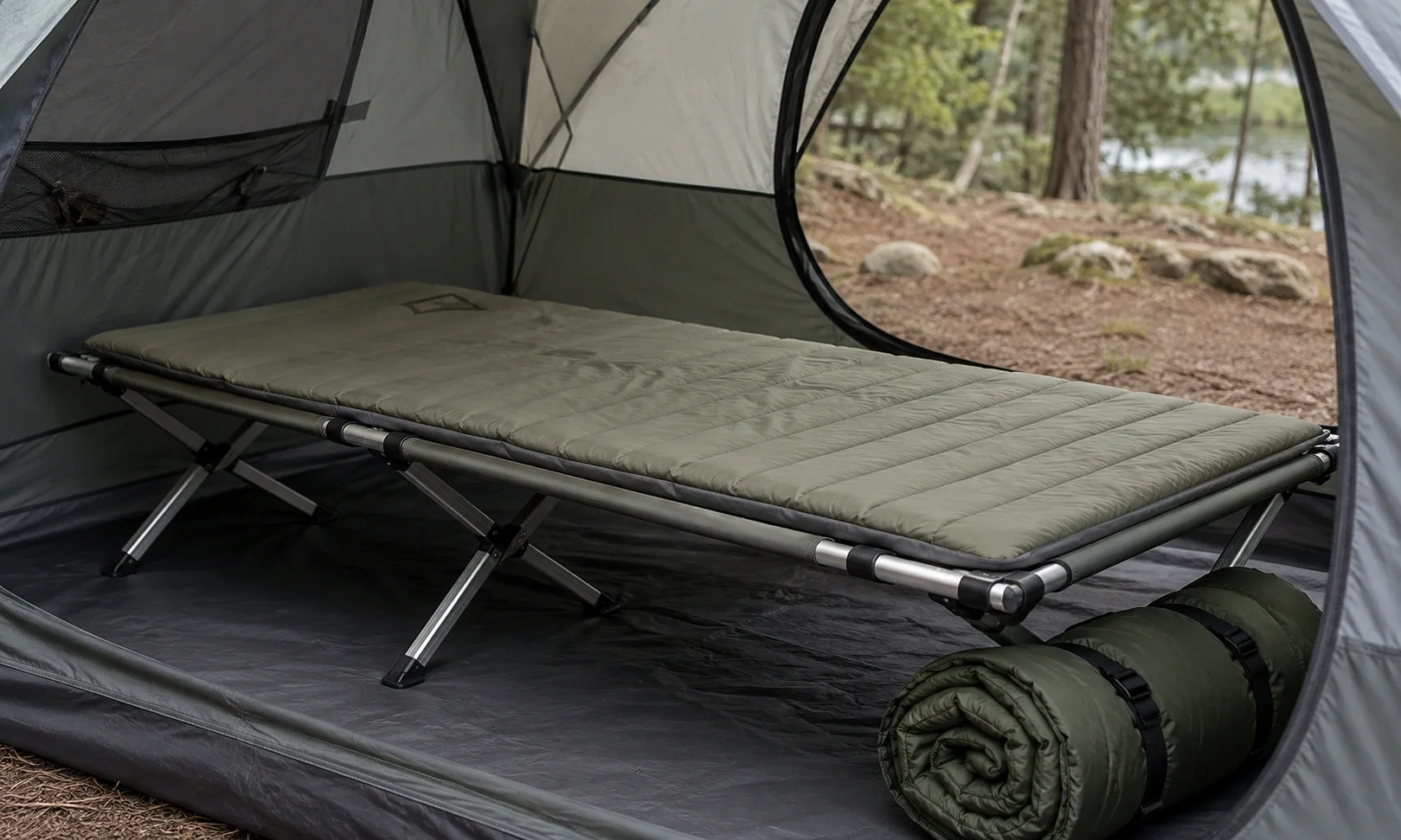 Folding camping cot with padded mattress in a tent