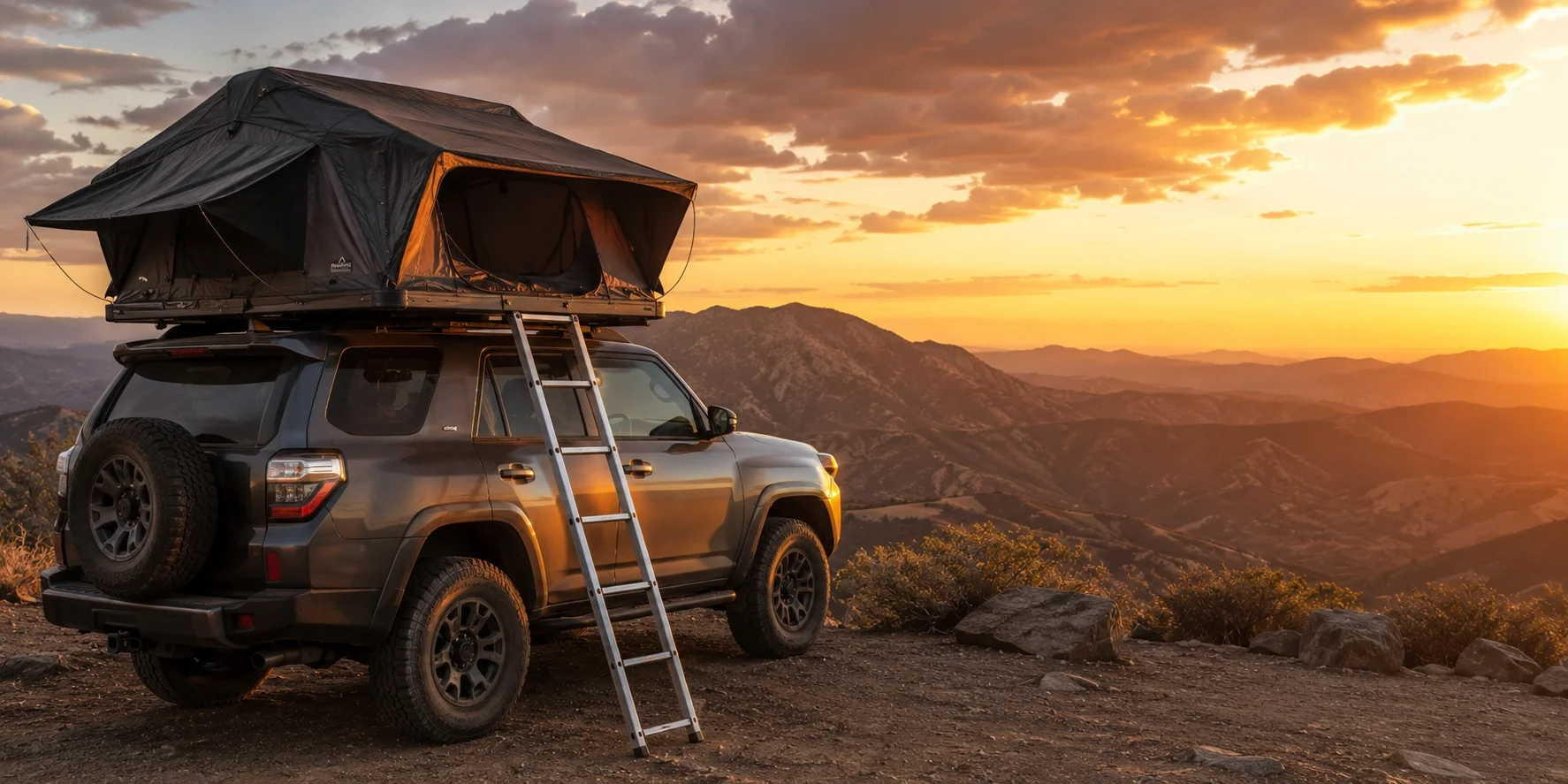 Roof top tent mounted on an SUV at a scenic overlook